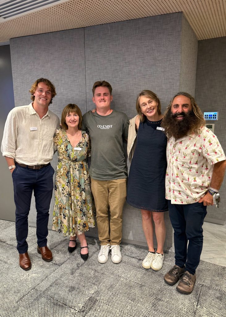 A group of people smiling for a photo
