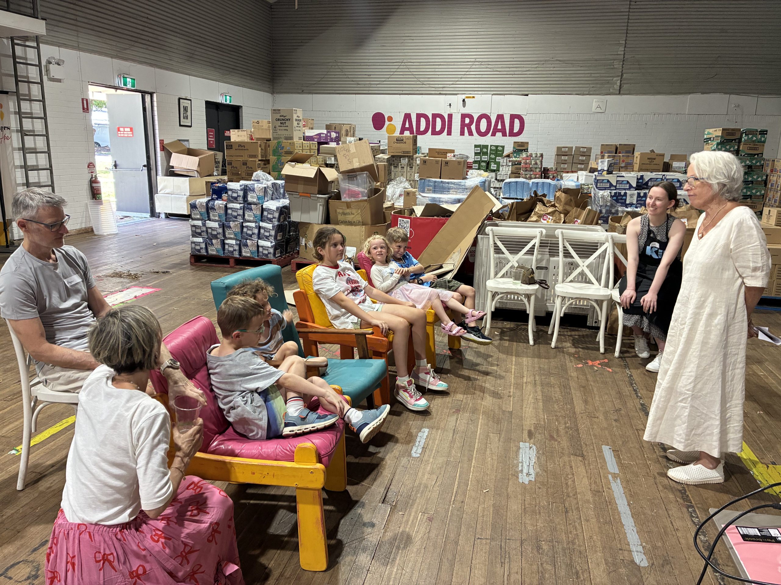 Group of young people sitting and listening to a talk