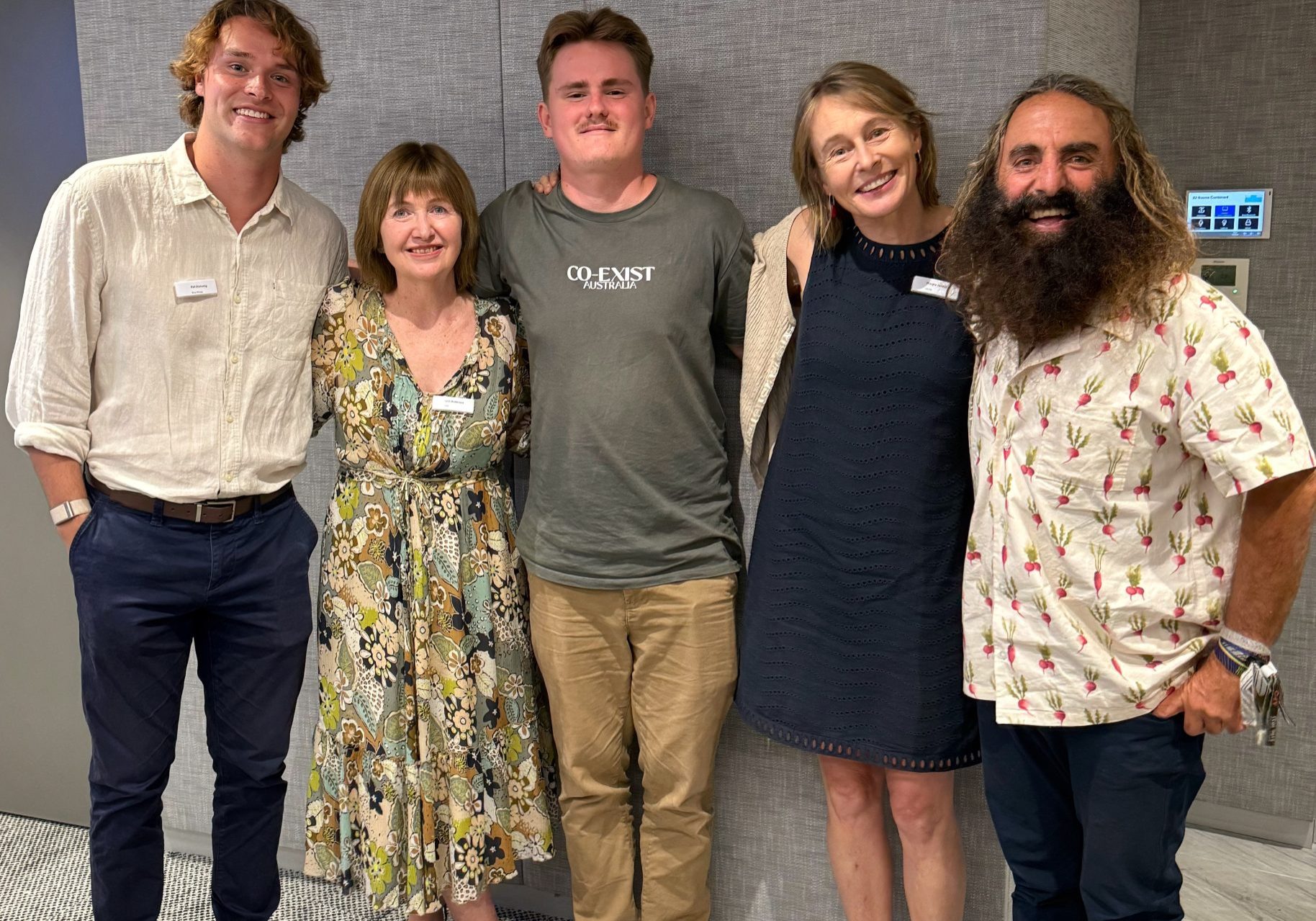 A group of people smiling for a photo